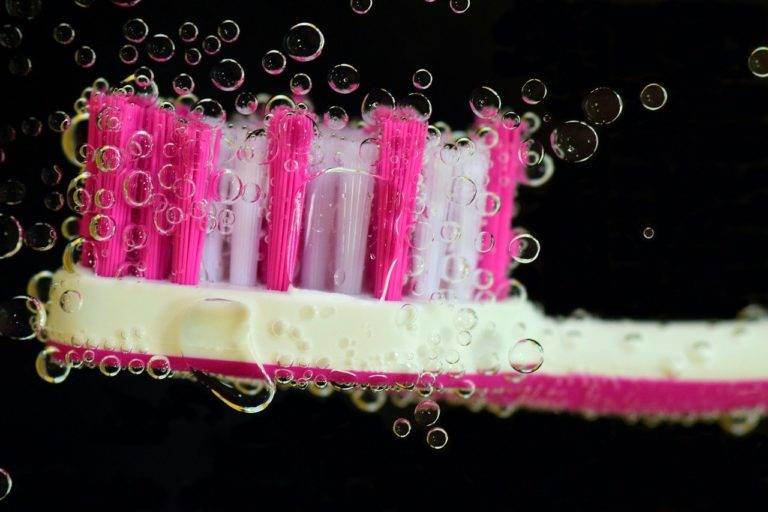 pink white toothbrush