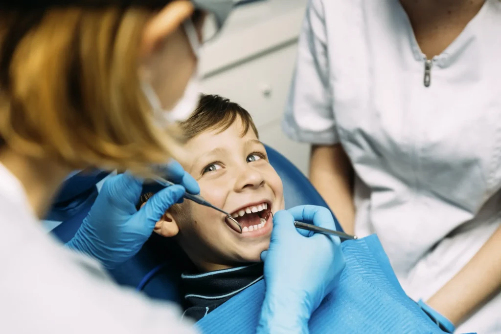 Boy getting dental treatment