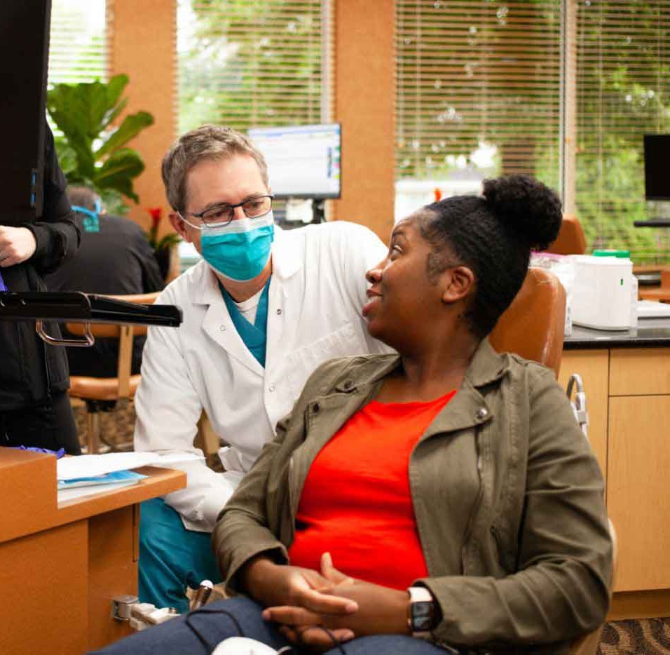 Orthodontist speaking with patient about treatment options